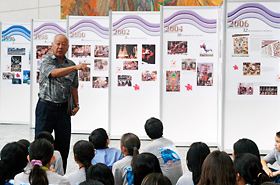 The school tour begins with a brief explanation on the Honolulu Festival.