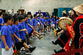 Students get to perform the traditional dance of the indigenous people of Alaska with the Alaska Native Heritage Center group.