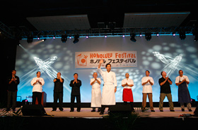 The participating chefs of Honolulu get up on stage to be introduced.