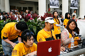 Students live streaming the Grand Parade in Waikiki.