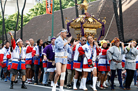 The Japanese Mikoshi carriers shouted in sync.