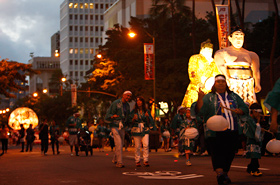 The sumo referee and the sumo wrestler gently swing from side to side. It is beautiful and also powerful.