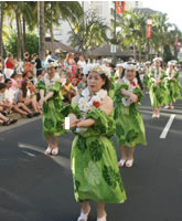 The Grand Parade takes place on Kalakaua Avenue in Waikiki, where you get to perform under the blue sky, next to the ocean and in front of a big audience.