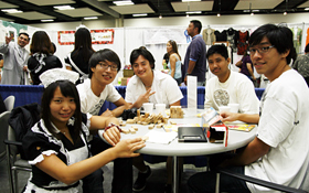 Maid and guests play Jenga together.