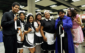 The maids of the Maid Cafe and guests  dressed in cosplay.