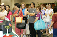 A line of attendees waiting to experience the art of ikebana