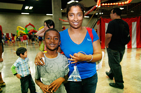 Mom and son, originally from Sri Lanka and currently living in Hawaii, experience fish scooping for the very first time. Looks like they did great!