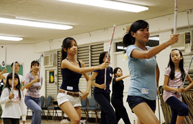 The dancers rehearsed their routine over and  over again. Serious faces. 