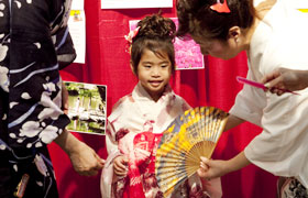 The little girl wears yukata and has her picture taken, creating a wonderful memory for her. 