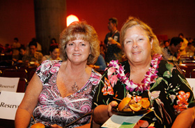 Guests in the front row enjoy the delicious dishes.