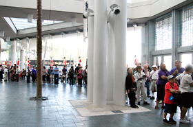 People were lined up in the foyer of the Hawaii Convention Center before opening time.
