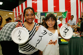 These two friends are from Honolulu. They made their own wall hanging with their names on it. Hope they decorate their rooms with it.