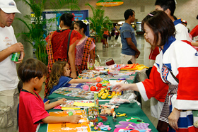 The kids were distracted by the number of prizes to choose from. Now which one do I want? 