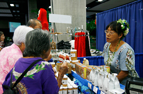 Many products made in Hawaii are sold at the Craft Fair. Taste testing is part of the fun.