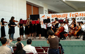 The students are members of the Kawananakoa Chamber Orchestra. Their beautiful music resonated throughout the Hawaii Convention Center.