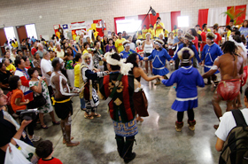 All three indigenous groups join hands to dance together.