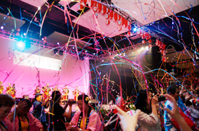 Suddenly, streamers of every color came gushing from the ceiling.