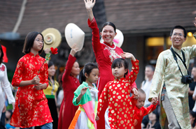 The Vietnamese Student Association of Hawaii parade down Kalakaua wearing their traditional Aozai.