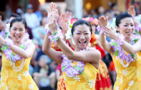 The ladies promote the city of Obama to the people of Hawaii with their smiles and hula.