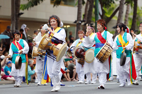 Members of the Korean Traditional Music Association of Hawaii. Drums and chimes have long been used as traditional musical instruments in Korea's folk dances, a tradition that continues to be preserved in Hawaii.