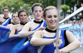 The Hempfield Spartan Marching Band from Pennsylvania. The color guards bearing flags.