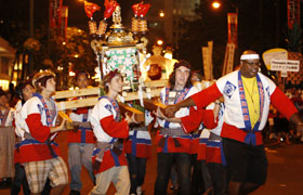 The students of Baldwin High School carry their winning Maui mikoshi based on this year's theme "Heart of the Pacific, Creating our Future."