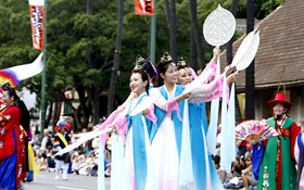 The dancers appear to be heavenly maidens in this traditional Korean dance.