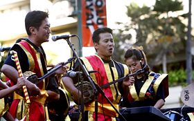 The Okinawa and Hawaii members of Ryukyu Koten Afuso-ryu OngakuKenkyuu Choichi Kai perform together.