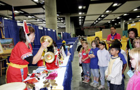 The musical instruments of Taiwan are introduced. The students and teachers look with curiosity.