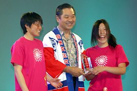 Award given to the girls by Mr. Sugi of the Honolulu Festival Foundation