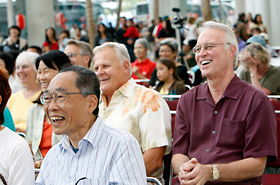 Smiles everywhere, throughout the stage area.