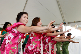 The members of Yutaka Hula Halau perform for the people of Hawaii with their beautiful smiles and graceful hula.